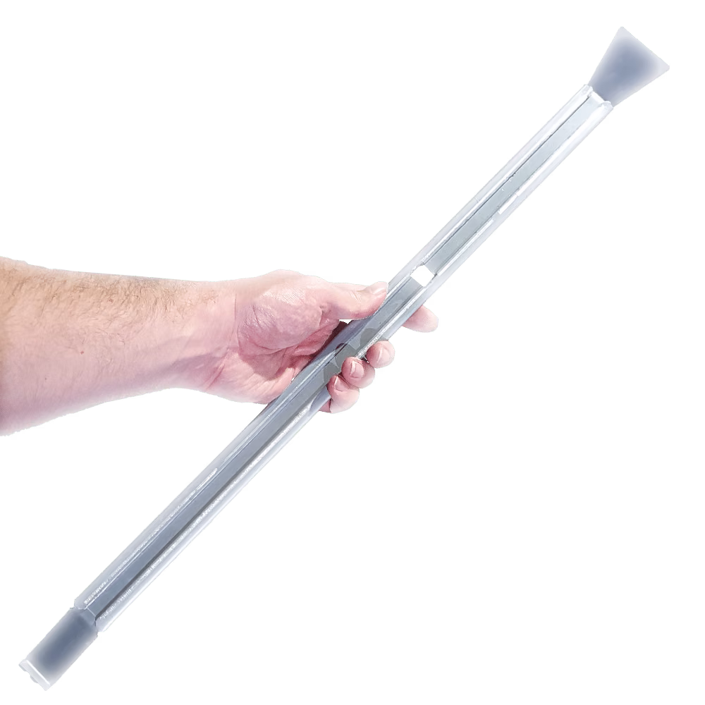 A hand holds a long, pale grey cleaning tool with flat ends.